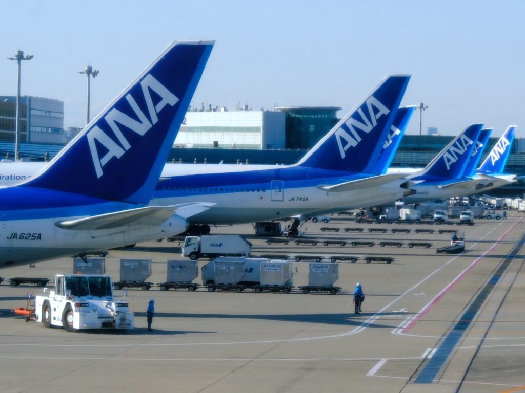 A flight from Tokyo was forced to divert to Seattle after an 'unruly' passenger tried to open the exit doors