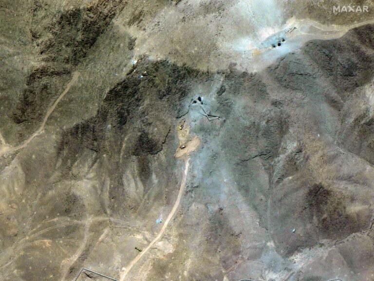 Satellite images appear to show excavators and bulldozers at work at Iran's bombed-out nuclear site