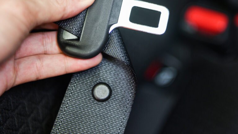 What Is That Little Button On Your Car's Seat Belt For?