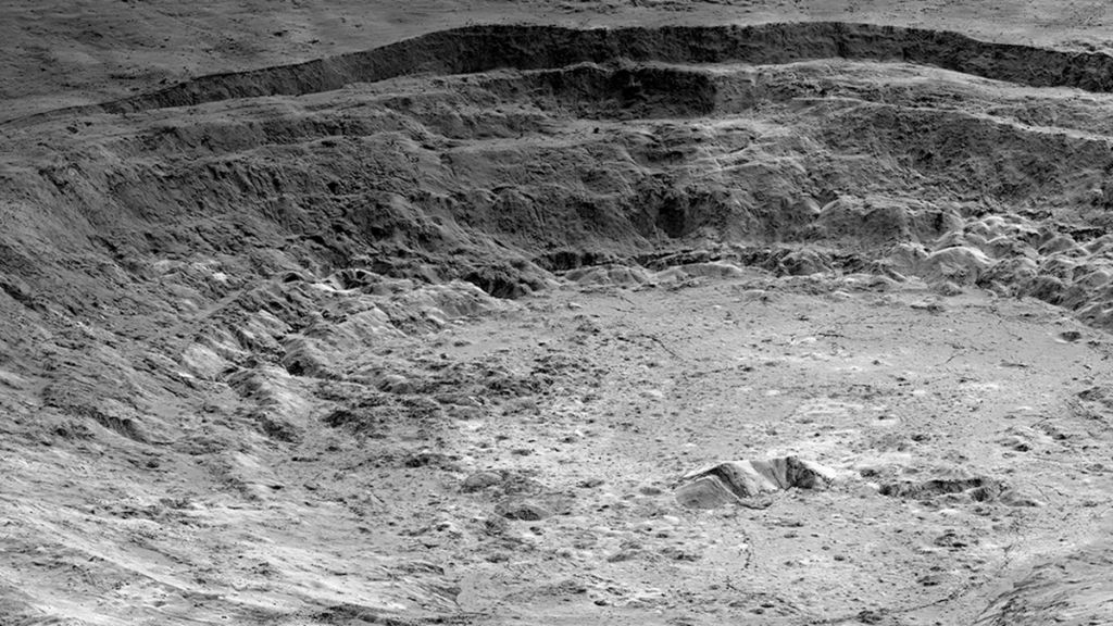 Gravity with an “Edge”: What Lies Beneath Aristarchus Crater