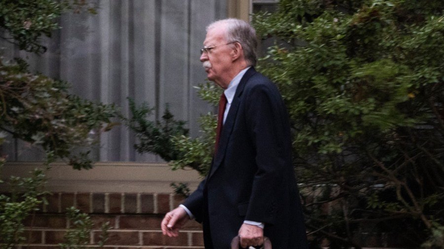 John Bolton arrives to surrender at Maryland courthouse