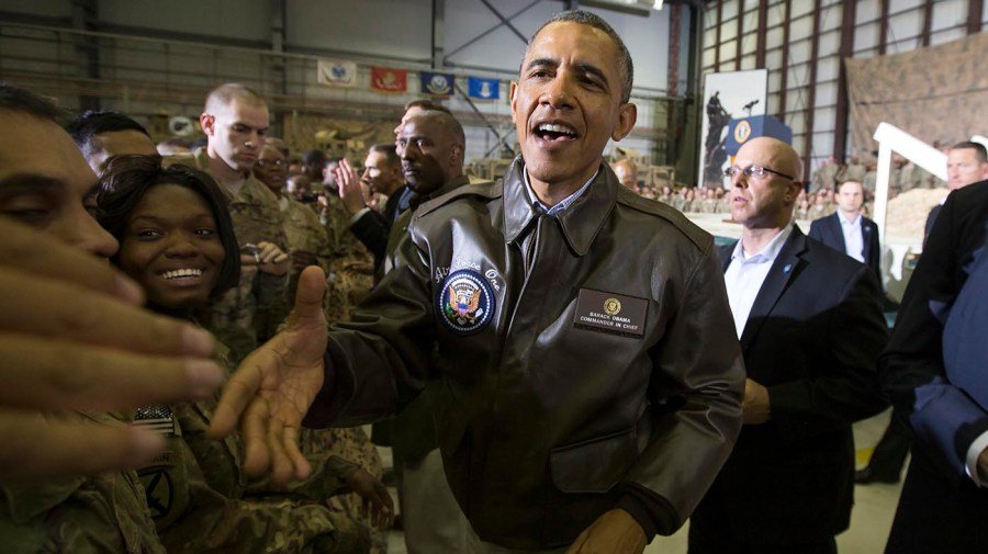 Obama surprised flight of veterans, families as they arrive in DC