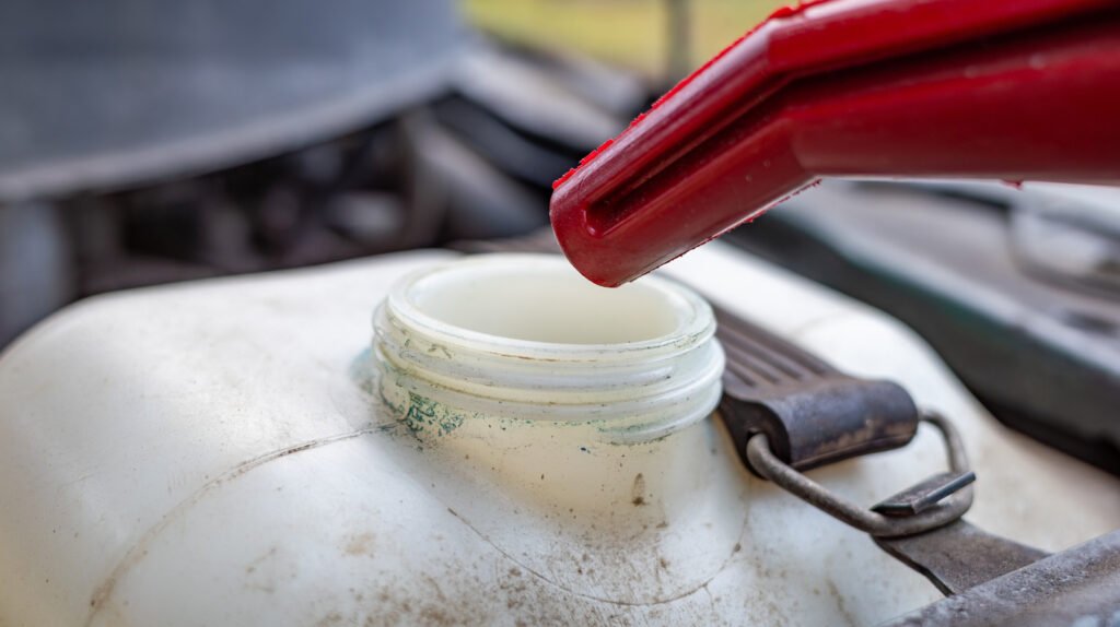 Why You Should Stop Using Tap Water In Your Windshield Washer Reservoir
