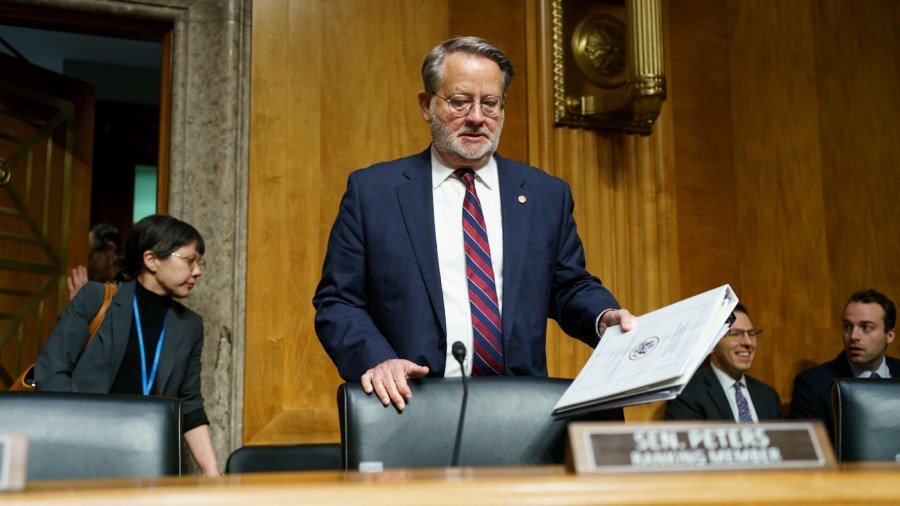 Peters presses Mullin to explain past comments: 'Where did you smell war?'