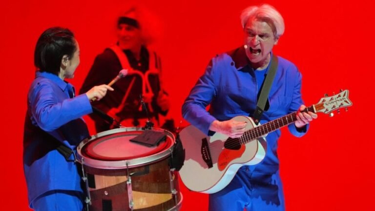 David Byrne showing 'ICE footage' during 'Life During Wartime' performances