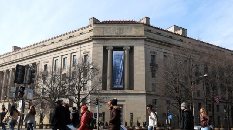 John Adams quote projected on DOJ building to protest 'anti-weaponization' fund