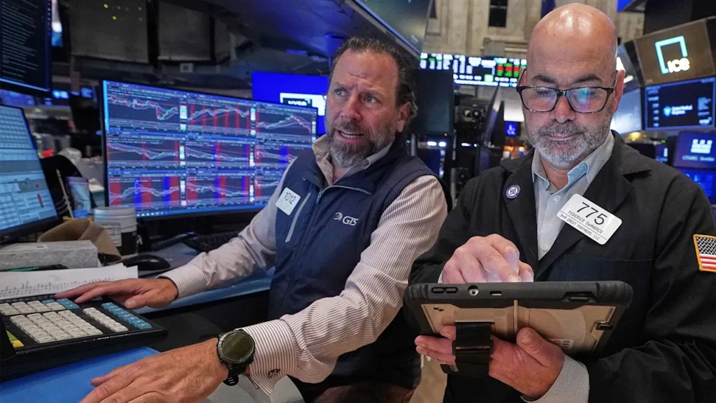 U.S. stocks slide from records as bond market rattles under pressure