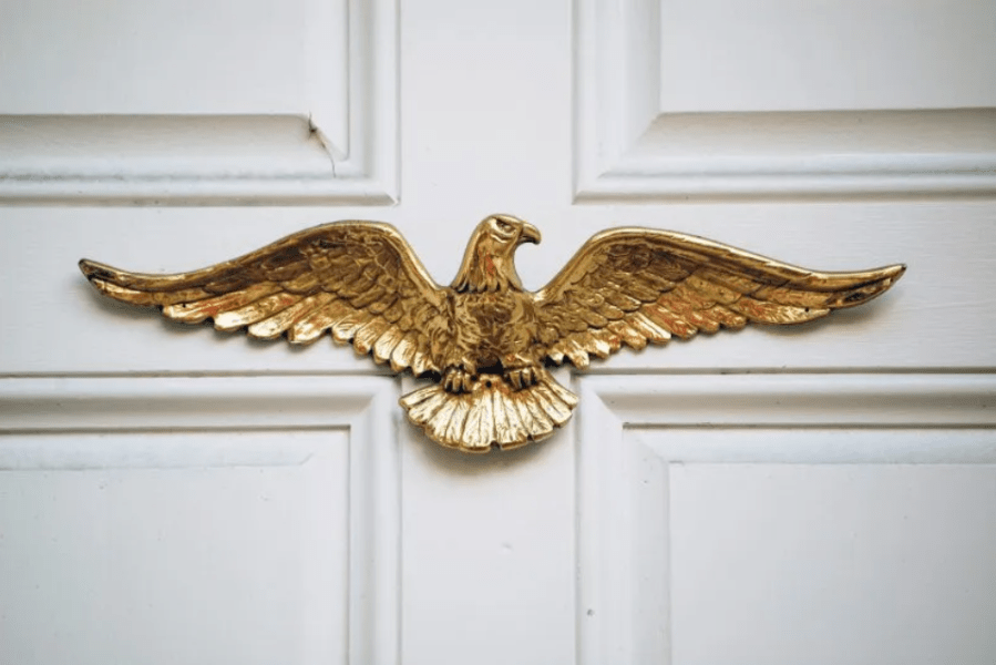 Eagle plaques on homes are an American tradition. Who qualifies for them?