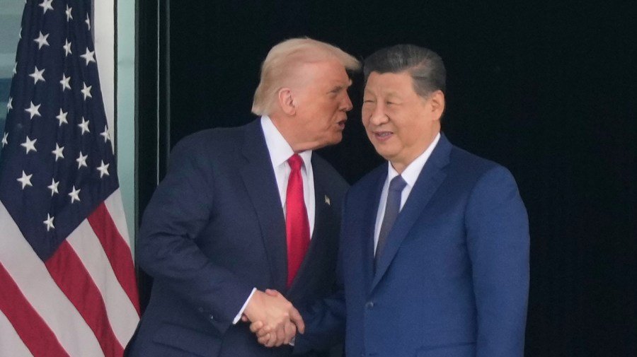 In Beijing, Trump easily holds the winning hand