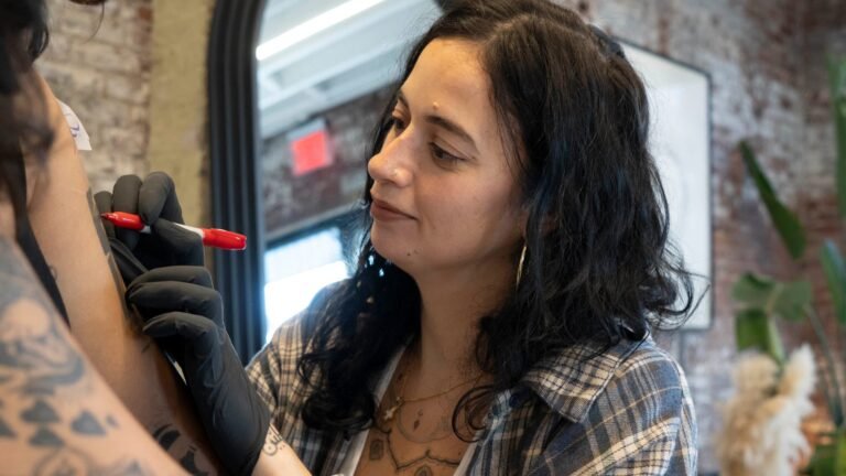 The Tattoo Artist Inking Arabic Script on Skin