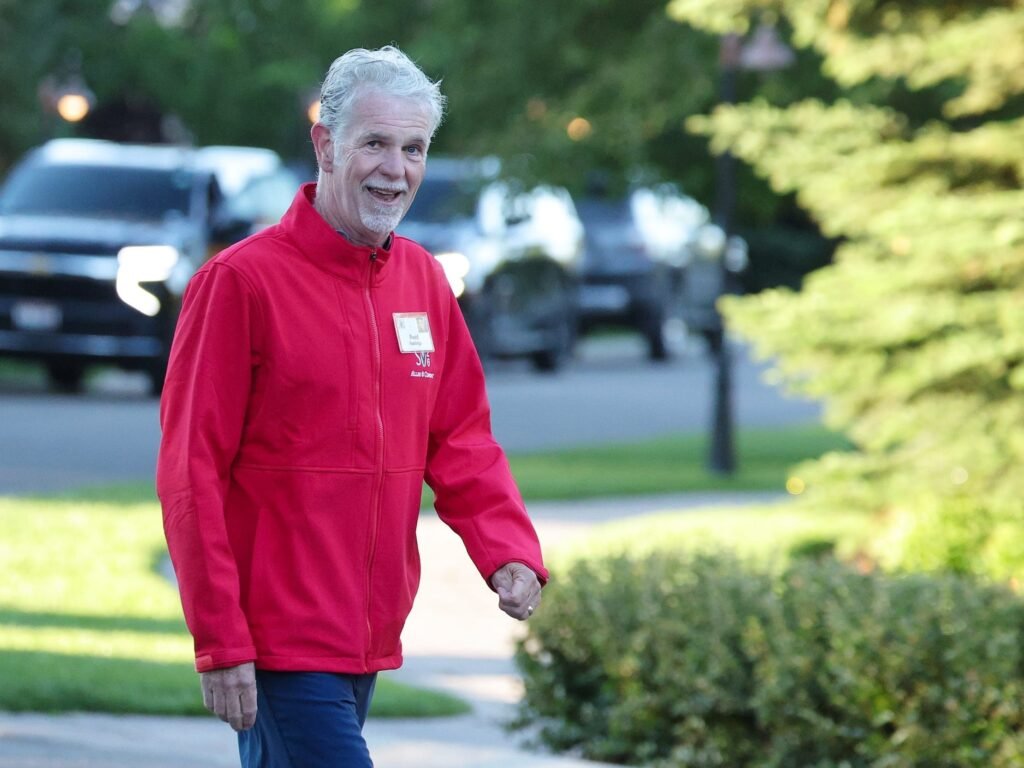 Reed Hastings says AI may push CEOs to cut their workforce in half — or expand their reach