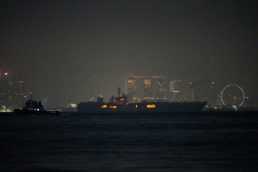 USS Abraham Lincoln sails past Singapore on way home from Middle East