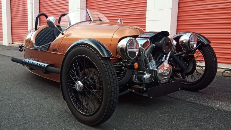 You Don't Need Anyone In Your Life Who Says You Don't Need This Orange Morgan 3-Wheeler