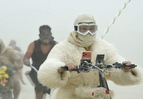 19 surreal photos show the mud, chaos, and glamour of Burning Man