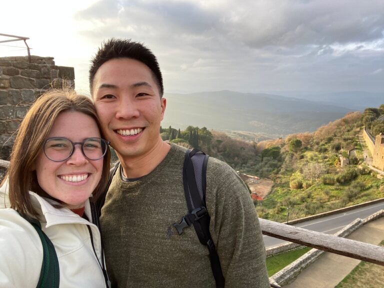 My husband and I both want to move abroad. We just can't agree on how much money we should save first.