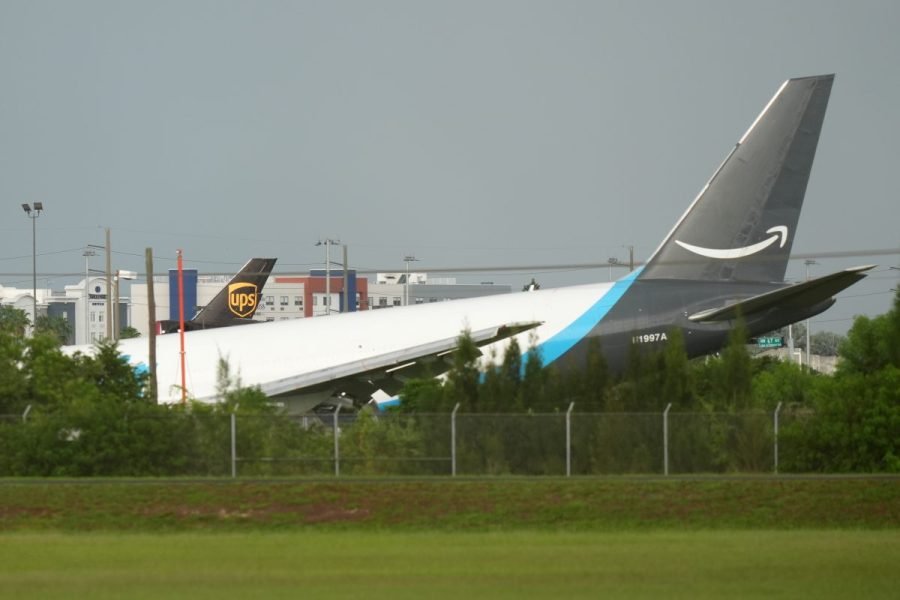 Amazon cargo plane sends up billowing cloud of smoke after overrunning runway at Miami airport