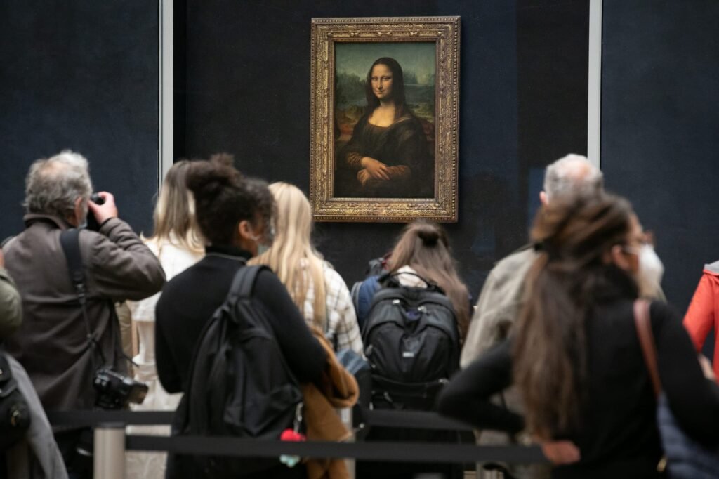 German Duo Arrested After Hanging Paintings Next to Mona Lisa