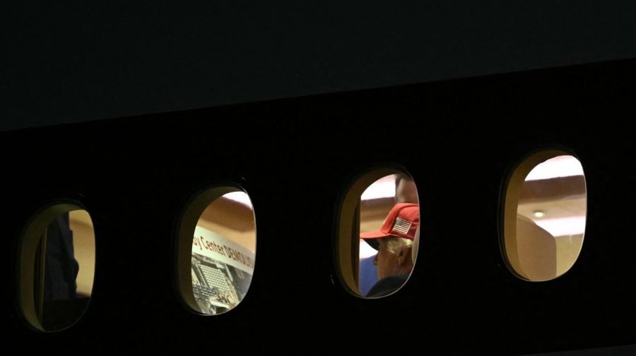 Trump appears to review poster about Kennedy Center demolition on Air Force One