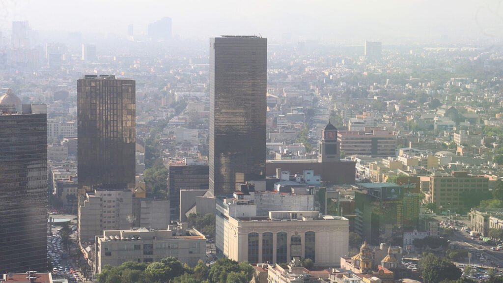 The Ozone Paradox: A Growing Cost of a Warmer Atmosphere